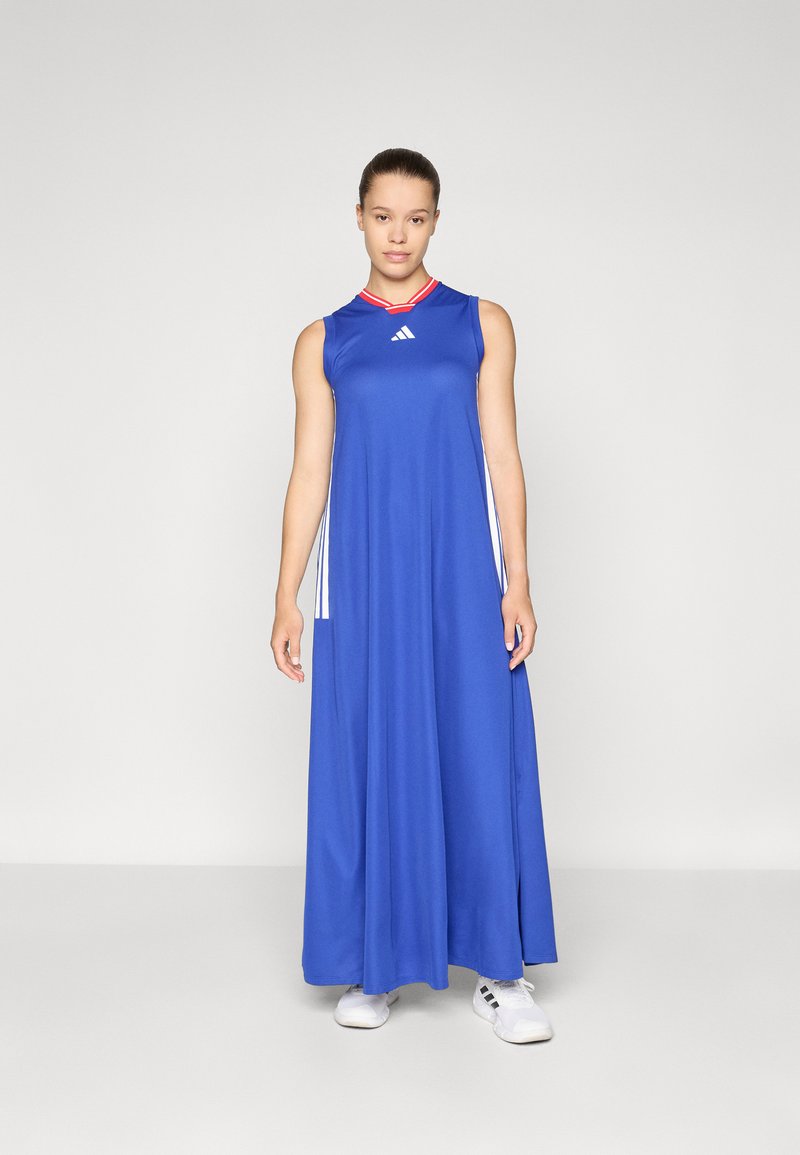 Blue sleeveless dress with a red collar and Adidas logo. Features side slits, relaxed fit, and a long, flowing design.