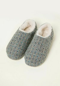 Wool blend slippers with a textured blue and brown pattern, soft white lining, and closed-back design. Features a slight elastic side tag.