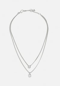 Layered silver necklace featuring two chains; one with a circular pendant and the other with a teardrop-shaped crystal.