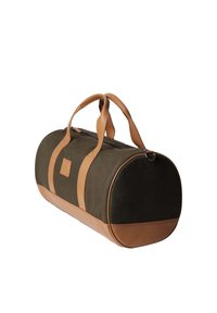 Sac de voyage cylindrique vert foncé avec des poignées, une base et des accents en cuir beige, présenté sur un fond blanc.