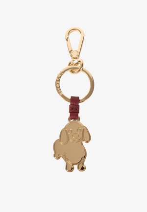 Portachiavi dorato con un design di un cane dei cartoni animati. Attaccato a una cinghia in pelle bordeaux e a un anello circolare dorato con un gancio.