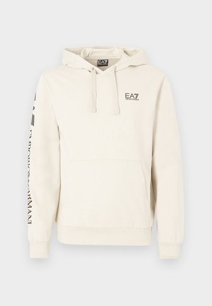 Kreminės spalvos džemperis su kapišonu, priekine kišene, raišteliais ir juodu „EA7 Emporio Armani“ logotipu ant krūtinės ir rankovės.