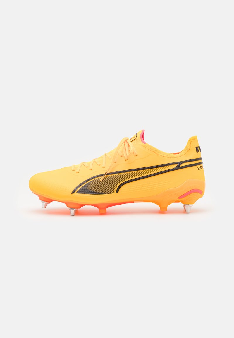Yellow soccer cleat with a textured upper, black accents, and pink detailing. Features six studs for traction on grass surfaces.