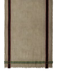 Woven textile with a soft, neutral beige base featuring vertical stripes in black, red, and green, with frayed edges.