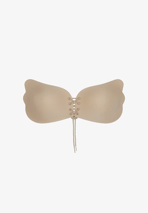 Reggiseno adesivo nude con coppe a forma di ala, dettaglio anteriore con lacci e texture liscia. Progettato per un supporto discreto e per essere indossato senza spalline.