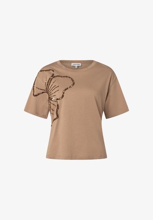 Beige short-sleeve t-shirt with large brown sequin floral design on the left shoulder and chest area.
