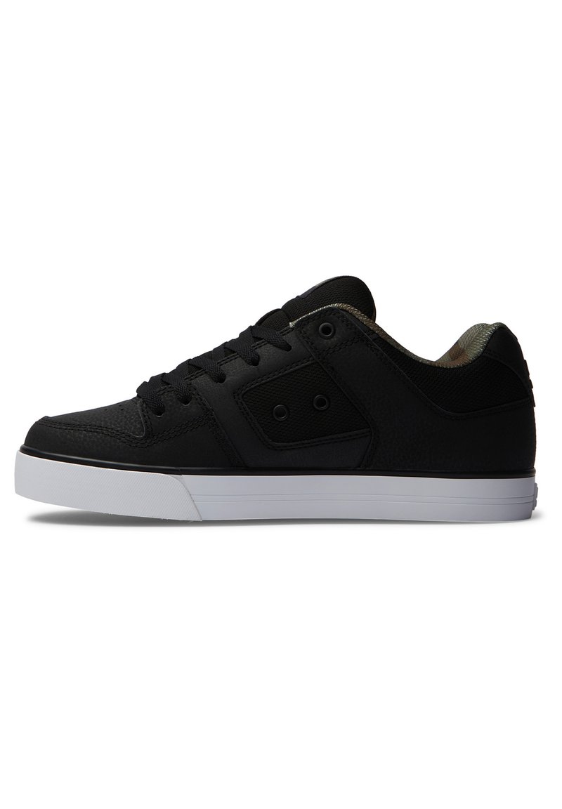 Black sneaker with a textured upper, round toe, and white rubber sole. Features lace-up design and camouflage lining. Accented with circular hardware.