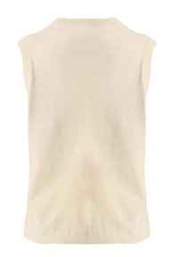 Débardeur en tricot de couleur crème, à texture lisse, avec un col rond et un ourlet côtelé. Design simple et minimaliste.