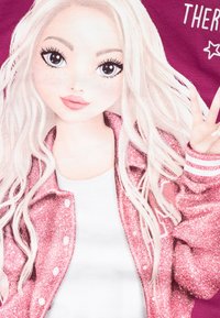 Graphic t-shirt featuring a character with long, wavy white hair, wearing a glittery pink jacket over a white shirt, making a peace sign.