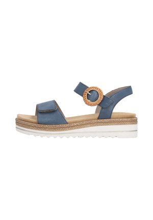 Sandale bleue à bout ouvert avec bride ajustable et boucle ronde tressée, semelle intérieure matelassée couleur tabac, semelle plateforme superposée avec bande de roulement blanche.