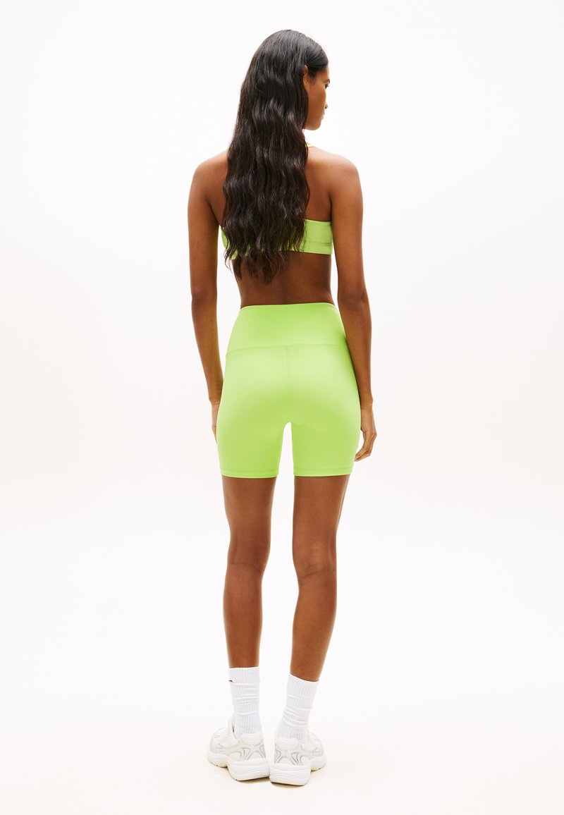 Tommy Jeans ATHLEISURE INTERLOCK KNIT CYCLE SHORTS - Legíny - kalhoty - faded lime