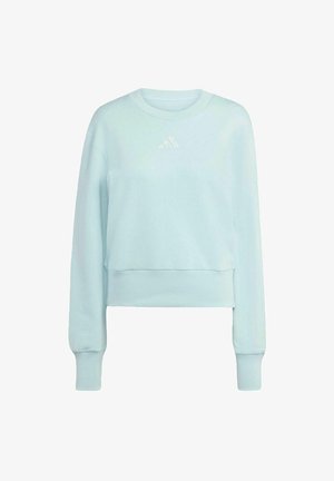 Sudadera corta de color azul claro, hecha de un tejido suave. Cuenta con mangas largas, cuello redondo y un discreto logo blanco en el pecho.