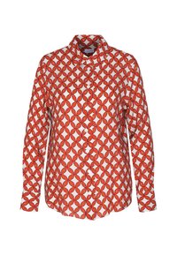 Långärmad skjorta med vit bas och ett sammanflätat mönster av orange kedjor.