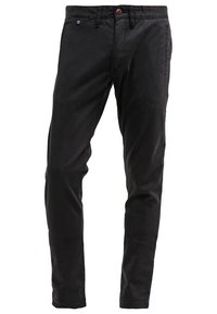 Pantalon noir slim pour homme avec passants de ceinture, fermeture à boutons sur le devant et poches latérales, présenté sur fond blanc.
