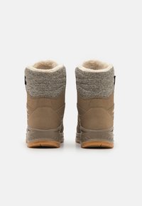 Brown winter boots with gray fabric tops, fleece lining, and textured rubber soles; features a cushioned collar and stitched accents.