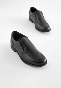 Schwarze Leder-Slipper mit glatter Oberfläche, subtilen Nähten und einem flachen Absatz für Komfort. Schmale Zehenform und elegantes Design.