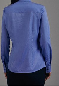 Blue, fitted dress shirt made of smooth fabric. Features a collar, buttoned cuffs, and a back seam. No notable patterns or accents.