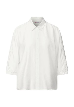 Blouse blanche à manches courtes avec un devant boutonné, un col classique et des poignets froncés. Fabriquée en tissu doux avec une texture lisse.