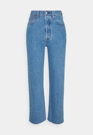 Modré džíny z denimu s vysokým pasem, rovnými nohavicemi, předním zapínáním na knoflíky a zip, pěti kapsami a viditelnými švy.