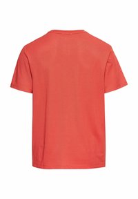 T-shirt z krótkim rękawem w kolorze koralowym, gładki design, materiał bawełniany, okrągły dekolt, prosty dół oraz minimalne detale przes stitching.