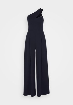 Marineblauer Ein-Schulter-Jumpsuit mit tailliertem Oberteil, weit geschnittenen Hosenbeinen und vertikalen Falten, aus einem glatten, strukturierten Stoff.