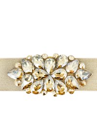 Fascia elastica beige con un gruppo di grandi gemme sfaccettate trasparenti e ambra, a forma di goccia e rotonde, disposte in un motivo floreale.