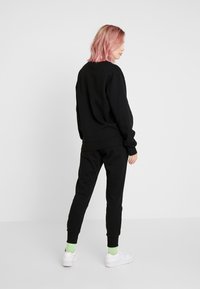 Ellesse FRIVOLA - Jogginghose - black