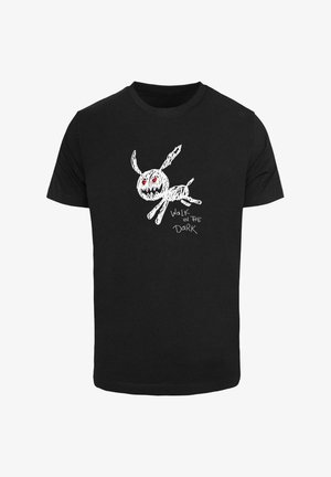 Black cotton t-shirt featuring a white sketch of a rabbit with red eyes and the text "WALK IN THE DARK" below the design.