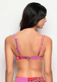 Pink and orange bandeau bikini top with a patterned design and adjustable straps, featuring a clasp closure at the back.