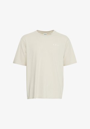 Bežinė medvilninė marškinė su trumpomis rankovėmis ir apvaliu kaklu. Kairėje krūtinės pusėje yra užrašas "A.R.C." balta spalva. Minkšta tekstūra, laisvas kirpimas.