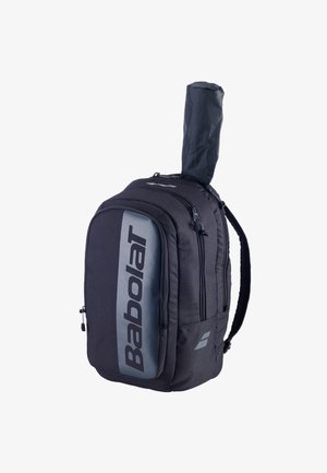 Black and gray Babolat tennis backpack with multiple zippered compartments and a padded cover holding a tennis racket handle.