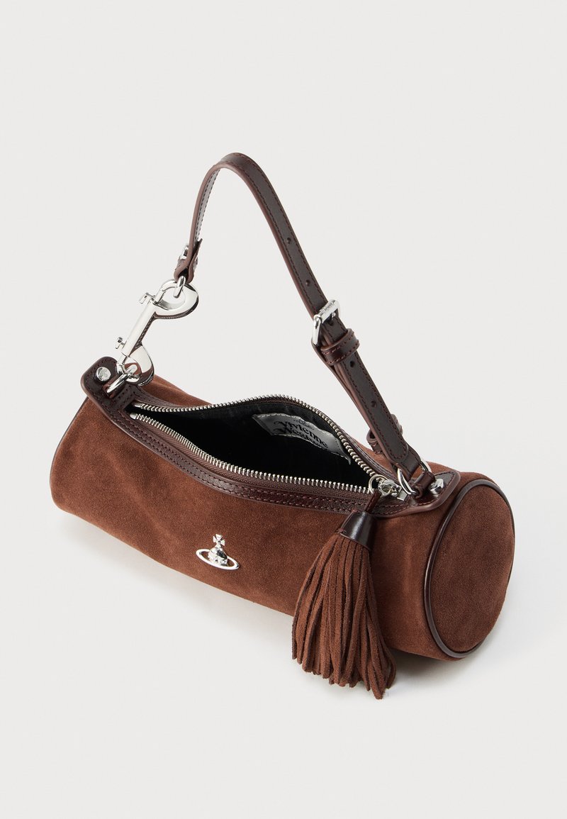 Brown suede cylindrical bag with a leather strap, silver hardware, zipper closure, and a tassel accent on the side. Interior is black.