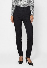 Black denim skinny jeans with a high waist, featuring two front pockets, front button closure, and a smooth texture.
