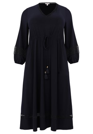 Marineblaues, knielanges Kleid mit V-Ausschnitt, elastischem Bund, geflochtenem Stickmuster an den Ärmeln und Quastenakzenten. Weicher Stoff, lockere Passform.