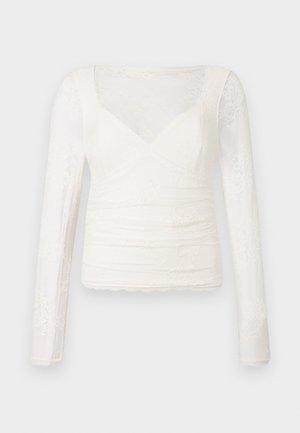 Wit blouse met lange mouwen, gemaakt van gestructureerde kant, met een V-hals, geplooide details en een gegolfde zoom.