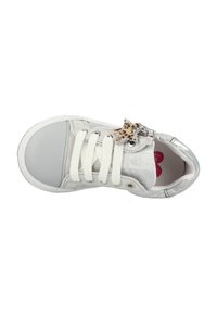 White sneaker with silver accents, textured upper, smooth toe cap, white laces, and a leopard print star charm on the side.