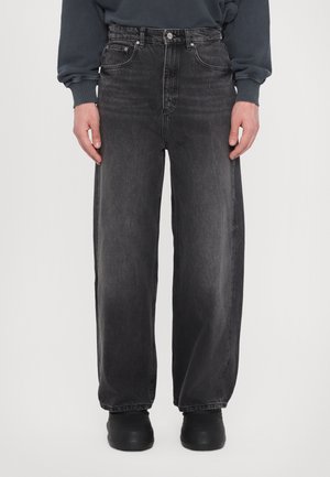 Baggy black denim jeans with a high waist, featuring five pockets, a button closure, and subtle fading along the legs. Finished with a straight cut.