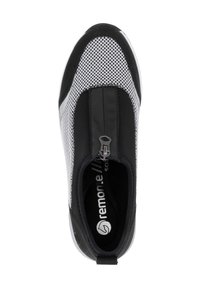 Black and white slip-on shoe featuring a mesh upper, smooth black accents, a zip closure, and a cushioned insole with logo.