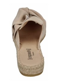 Beige espadrille sandal with a textured suede upper, bow detail, jute-wrapped sole, and a flat rubber base. Interior shows brand logo.