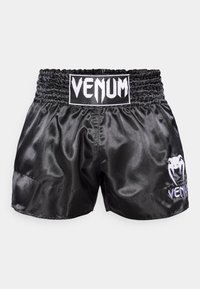 Calções de boxe em cetim preto com cintura elástica, com o logótipo branco "VENUM" na frente e um gráfico de aranha na lateral.