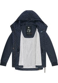 Veste bleu marine à pois blancs, doublure en polaire, capuche réglable et détails en métal contrastants. Fermeture zippée et poches latérales.