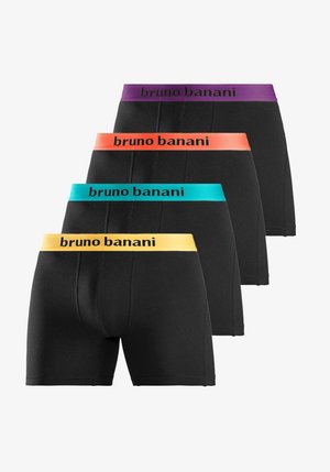 Mehe ülakeha ja jalad, kes kannab musti bokserpükse oranži vööümbrisega, millel on kiri „bruno banani“, käsi hoiab vööd kinni.