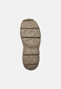 Textured rubber outsole in light taupe with black speckles, featuring grooves and ridges for traction. Branded with "Comprex" and size 42.