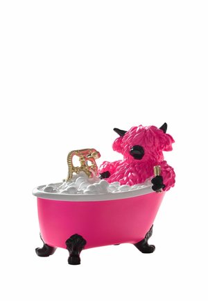 Pink buffalo figure with black horns relaxing in a pink clawfoot bathtub filled with bubbles, holding a small gold object.