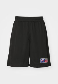 Pantalones cortos deportivos negros hechos de material de malla transpirable con una cinturilla elástica. Presenta un parche con el logo y bolsillos laterales para mayor funcionalidad.