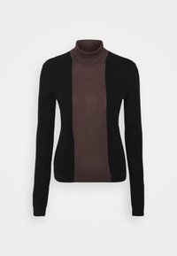 Kvinnors långärmad polotröja med svarta ärmar och sidor, samt ett brett mörkbrunt vertikalt rand ner i mitten fram.