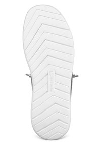 Semelle en caoutchouc blanche avec motif de bande de roulement en zigzag, comportant une étiquette de logo rectangulaire. Côté en tissu gris sans attaches visibles.