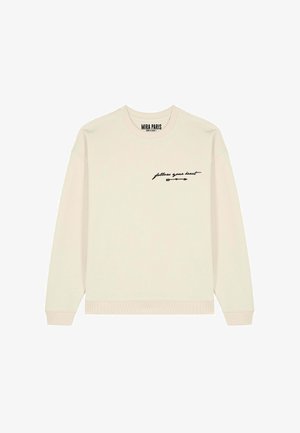 Felpa beige a maniche lunghe con testo "segui il tuo cuore" e design a freccia sul petto sinistro, polsini e orlo a coste, etichetta Mira Paris all'interno del colletto.