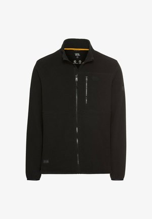 Black fleece jacket with a high collar, full zipper, and two zippered pockets. Features minimalistic design with a logo on the sleeve.