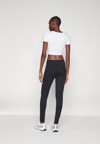 Champion GRAPHIC LEGGINGS - Leggings - black